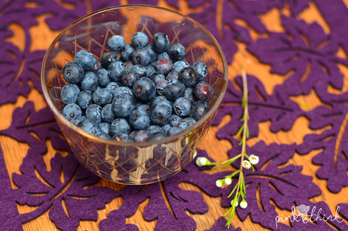 Blueberries with a flower on the side
